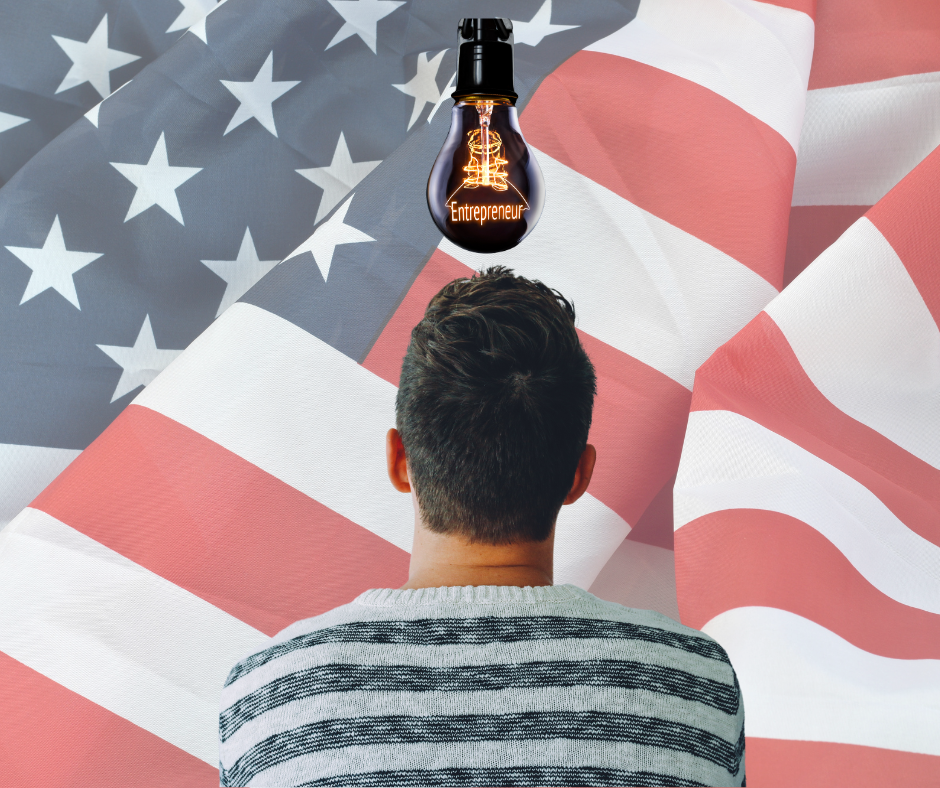A person facing away from the camera, observing a US flag, while a lightbulb with the message 'Entrepreneur' hovers above their head.